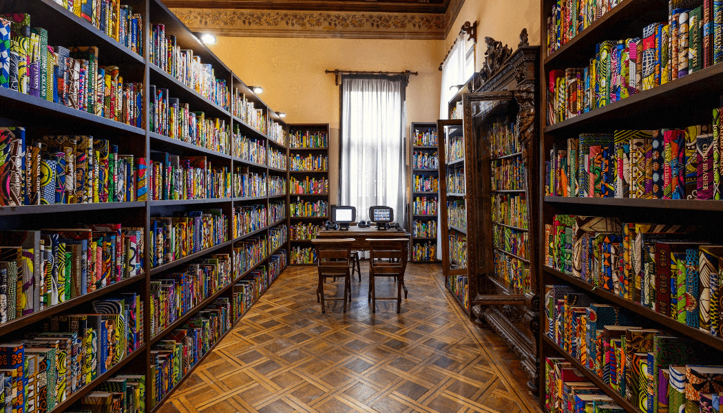 A room in The British Library features shelves filled with colourfully backed books