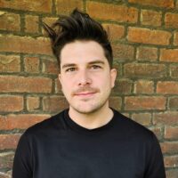 Sean Curran (they/them) headshot